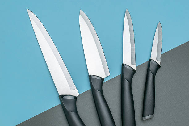 istock Set of Professional Kitchen Knives Displayed on a Modern Blue and Gray Background 2253928229