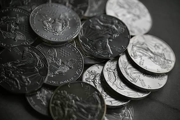 istock High resolution close up color image of American Silver Eagle Coins Stacked in Pile, Silver Bullion Investment Concept 2253928366