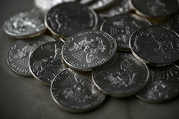 istock High resolution close up color image of American Silver Eagle Coins Stacked in Pile, Silver Bullion Investment Concept 2253928396