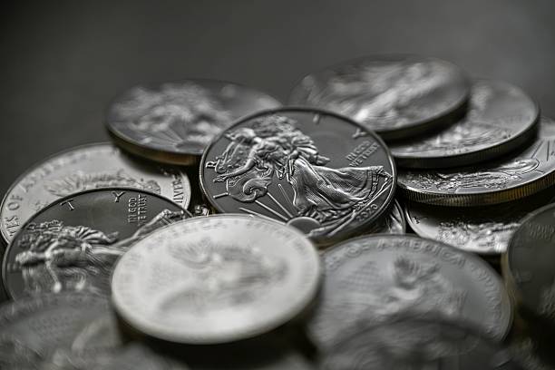 istock High resolution close up color image of American Silver Eagle Coins Stacked in Pile, Silver Bullion Investment Concept 2253928429