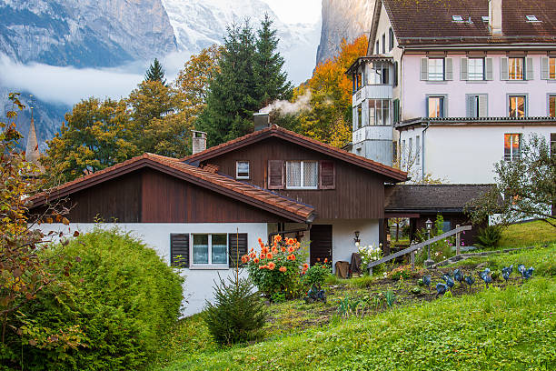 Lauterbrunnen, Switzerland - Oct 13, 2025. Traditional wooden house in the beautiful village of Lauterbrunnen, Switzerland.