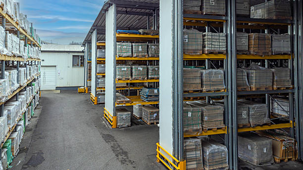 istock An outdoor warehouse storage facility filled with many stacked pallets. 2253931063