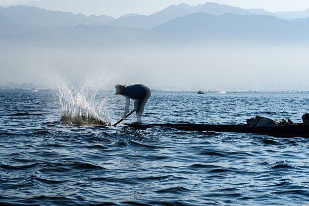 The iconic sight of Inle Lake in Myanmar is the leg rowing Intha fishermen.