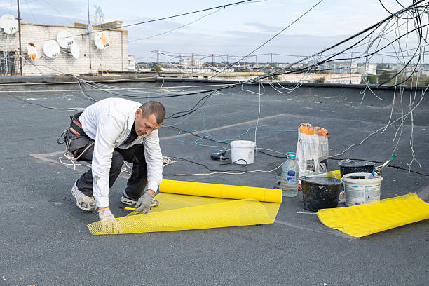 istock The construction worker prepares yellow mesh for insulation work on the facade. 2253934226