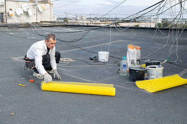 istock The construction worker prepares yellow mesh for insulation work on the facade. 2253934235