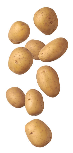istock raw unpeeled potatoes falling isolated white 2253934519