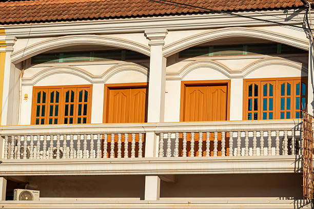 Windows and balconies of the new building at day time.