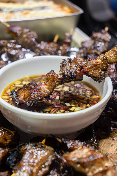 Grilled Pork Skewer Dipped in Spiced Vinegar Sauce