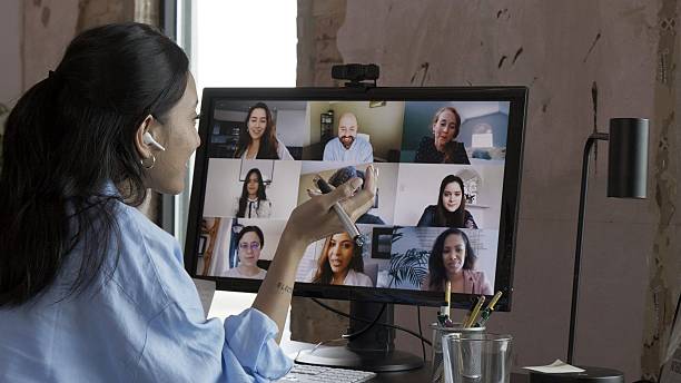 istock Diverse group of people having a discussion on a video conference call. 2253936547
