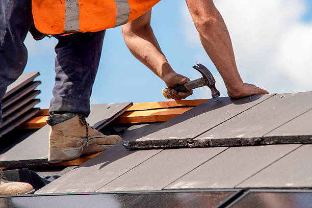 istock Construction worker roofers installing roofing tiles on residential building 2253936768