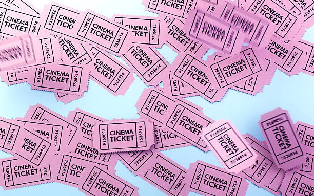 istock Scattered Pink Cinema Tickets on Blue Background with Motion Effect 2253938828