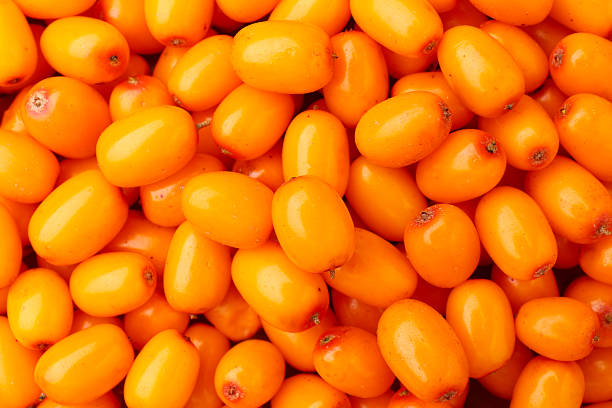 istock Fresh sea buckthorn berries as background, top view 2253938926
