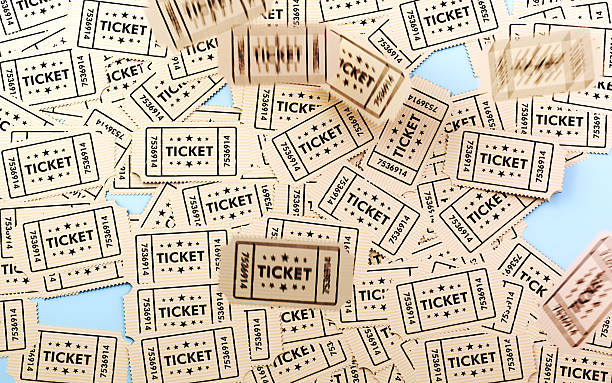 istock Scattered Beige cinema tickets on a blue background, with motion effects. 2253938989