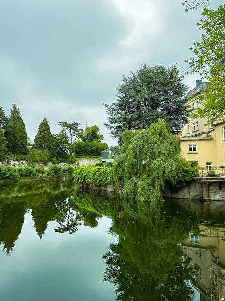 istock In a tranquil countryside, a pond reflects lush greenery and overcast skies, creating an idyllic landscape perfect for outdoor photography and peaceful relaxation during summer days, epitomizing calm 2253939778