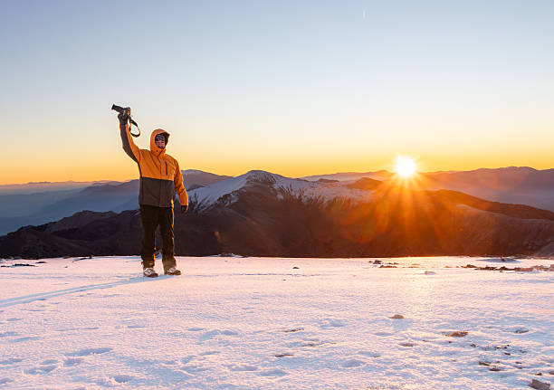 Alpinist climber is on a expedition of climbing an high altitude mountain.