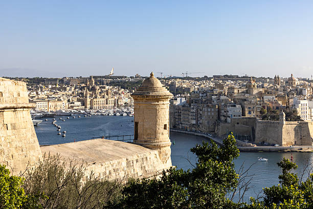 Valletta, Malta, 05 July, 2013 : View from tourist boat of watchtower on fortress wall of Fort St Angelo in Birgu city in ​​Malta