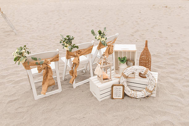 istock Soft Pastel Beach Wedding Decor with Burlap, Rustic White Wood, Rattan, Ivory-Colored Roses, Cream Stock Spray Flowers & Sage-Green Eucalyptus for a Modern Rustic Beach Wedding in Jupiter, Florida in December 2025 2253946113