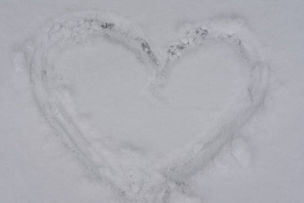 istock Drawn Heart on Snow Close Up 2253946199