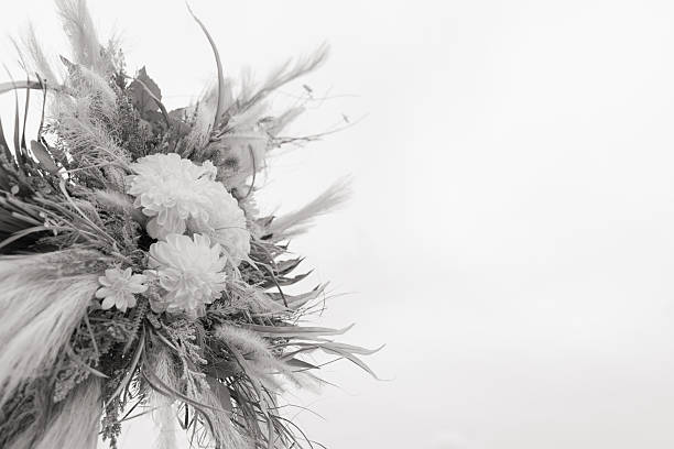 Soft Pastel Beach Wedding Decor with Burlap, Rustic White Wood, Rattan, Ivory-Colored Roses, Cream Stock Spray Flowers & Sage-Green Eucalyptus for a Modern Rustic Beach Wedding in Jupiter, Florida in December 2025.