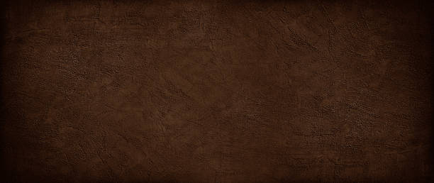 istock Black dark brown concrete wall texture background. Old rough scratched grungy surface. Industrial business construction. Close-up. Simple minimal. Blank empty. Template. Design. Wide banner. Panoramic. 2253948297