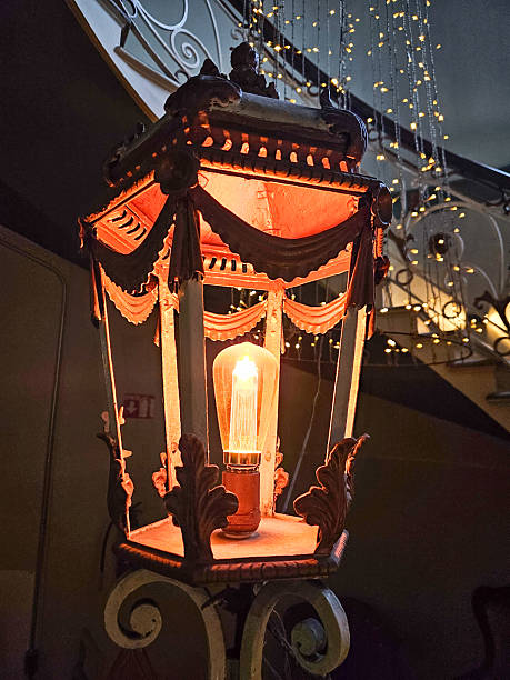 Ornate vintage style lantern featuring a warm glowing Edison filament bulb, cozy