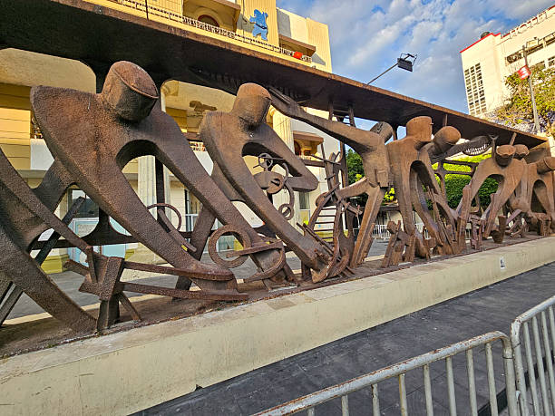 Chilpancingo, Mexico - December 21 2024: Sculpture in Chilpancingo, Mexico, depicting abstract metal figures symbolizing collective labor and community effort.
