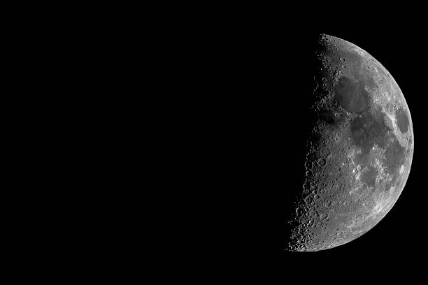 istock Half Moon with Detailed Craters Isolated on Black Night Sky 2253953090