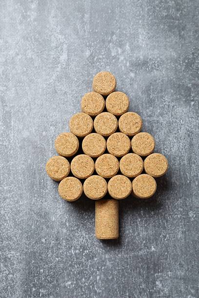 istock Christmas tree shaped wine corks on grey background. Top view with copy space for text 2253959675