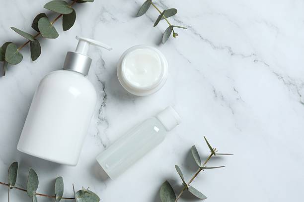 istock Natural cosmetic products with eucalyptus leaves on light background, top view 2253959754