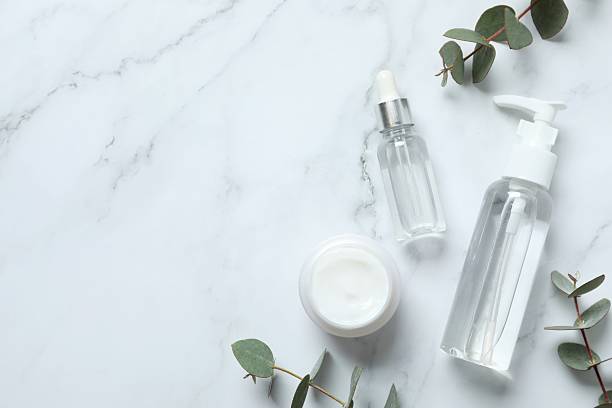 istock Natural cosmetic products with eucalyptus leaves on light background, top view 2253959761