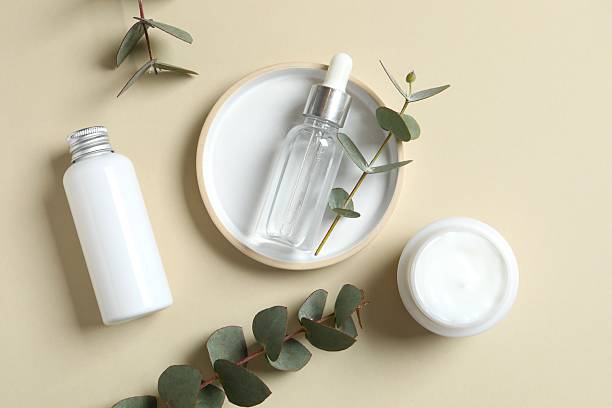 istock Natural cosmetic products with eucalyptus leaves on light background, top view 2253959900