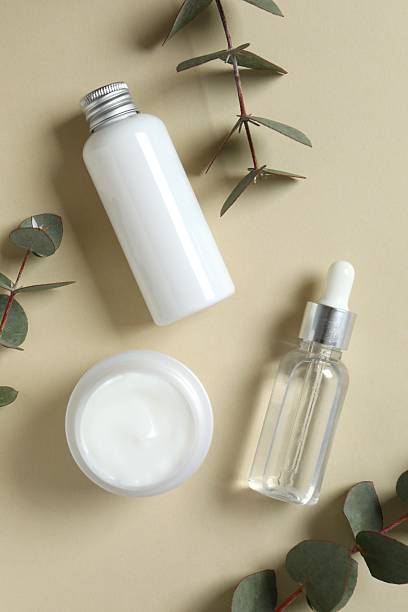 istock Natural cosmetic products with eucalyptus leaves on light background, top view 2253959902