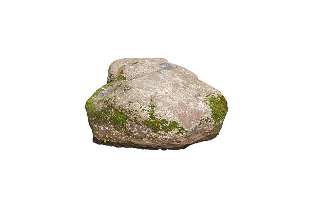 istock Large weathered stone boulder with moss patches is isolated. 2253960291