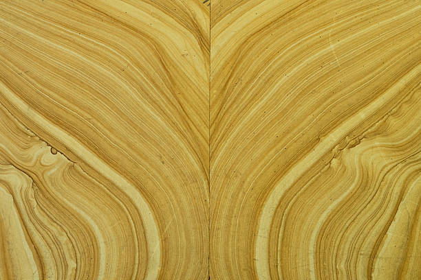Bookmatched marble onyx panels with V-shaped veins texture.
