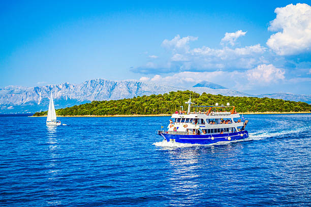 Zadar, Croatia - August 5, 2022: Passengers on the top deck of the catamaran ferry, travelling from Rijeka to Zadar and enjoying summer vacation