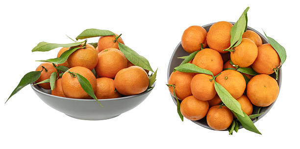 istock A plate with tangerines isolated on a white background 2253963066