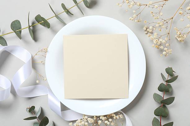 istock Wedding stationery invitation card mockup on grey background with eucalyptus, Menu card mockup with festive wedding or birthday table setting, ceramic plate. Minimal blank card mockup 2253966789