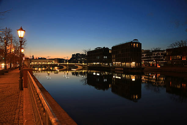 Walking on Odra River after sunset in historic part of Wroclaw, Poland