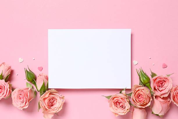 istock Beautiful composition with peony roses with paper card on pink background 2253967441