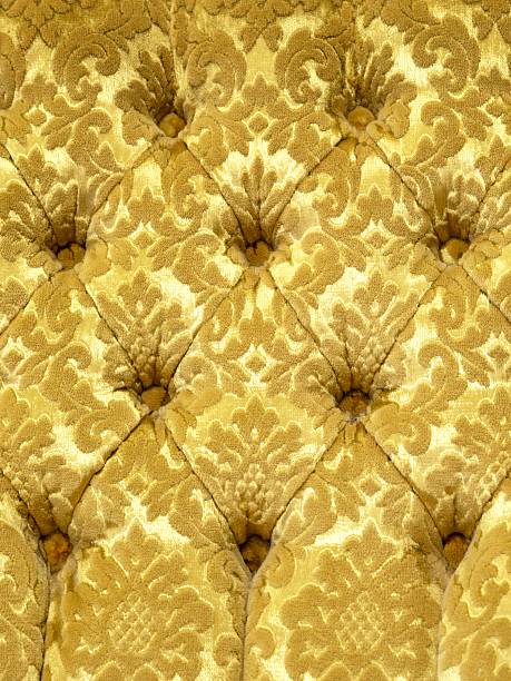 Velor surface of sofa close-up. Training equipment-velor mats tightened with buttons. Yellow chesterfield style quilted upholstery background close up