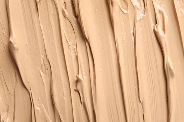 istock Texture of liquid foundation. Makeup base, BB cream smear background 2253969326