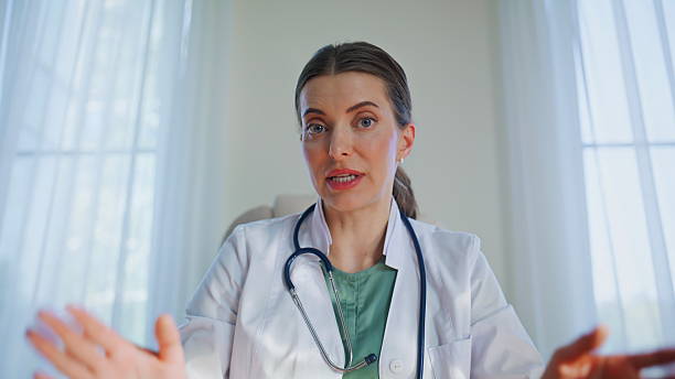 istock General practitioner consulting online talking medical office closeup pov video 2253973116