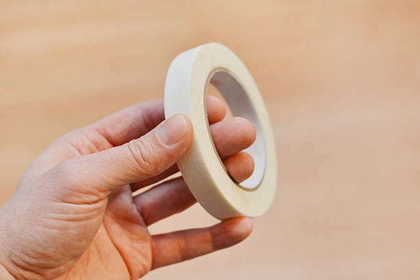 istock Masking Tape in Hand 2253973871