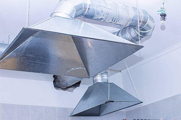 istock Stainless steel kitchen exhaust hood installed in modern commercial kitchen for improved ventilation and safety 2253975362