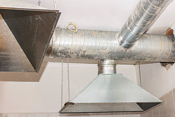 istock Stainless steel kitchen exhaust hood installed in modern commercial kitchen for improved ventilation and safety 2253975363