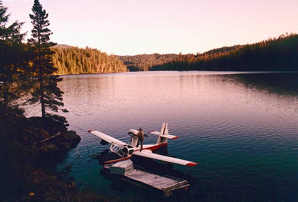 View of a Lake flying boat from a wilderness cabin on Toquaht Lake. Summer-run wild steelhead swim up the Toquaht River which makes for great fishing. Toquaht Lake is 13.9 miles from Ucluelet in Alberni-Clayoquot Regional District. The Toquaht are the people of Toquaht Bay, Mayne Bay and western Barkley Sound, and are one of the Nuu-chah-nulth Nations who have lived along Vancouver Island's west coast for over 10,000 years. Toquart is the Anglicized version of Toquaht which means 'people of the narrow channel'.