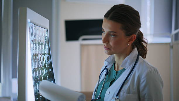 istock Physician checking x-ray scans preparing consultation at private clinic closeup 2253977255