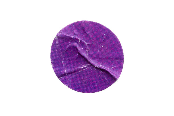 istock Blank purple round adhesive paper sticker label isolated on white background 2253980399