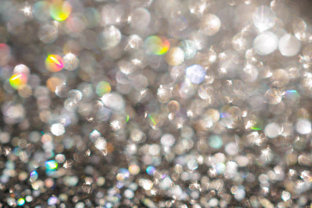Shiny luxury glitter rainbow glow light flare with bokeh background