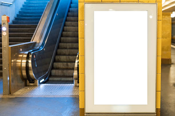 istock Vertical blank advertising lightbox near escalator in underground station 2253981284
